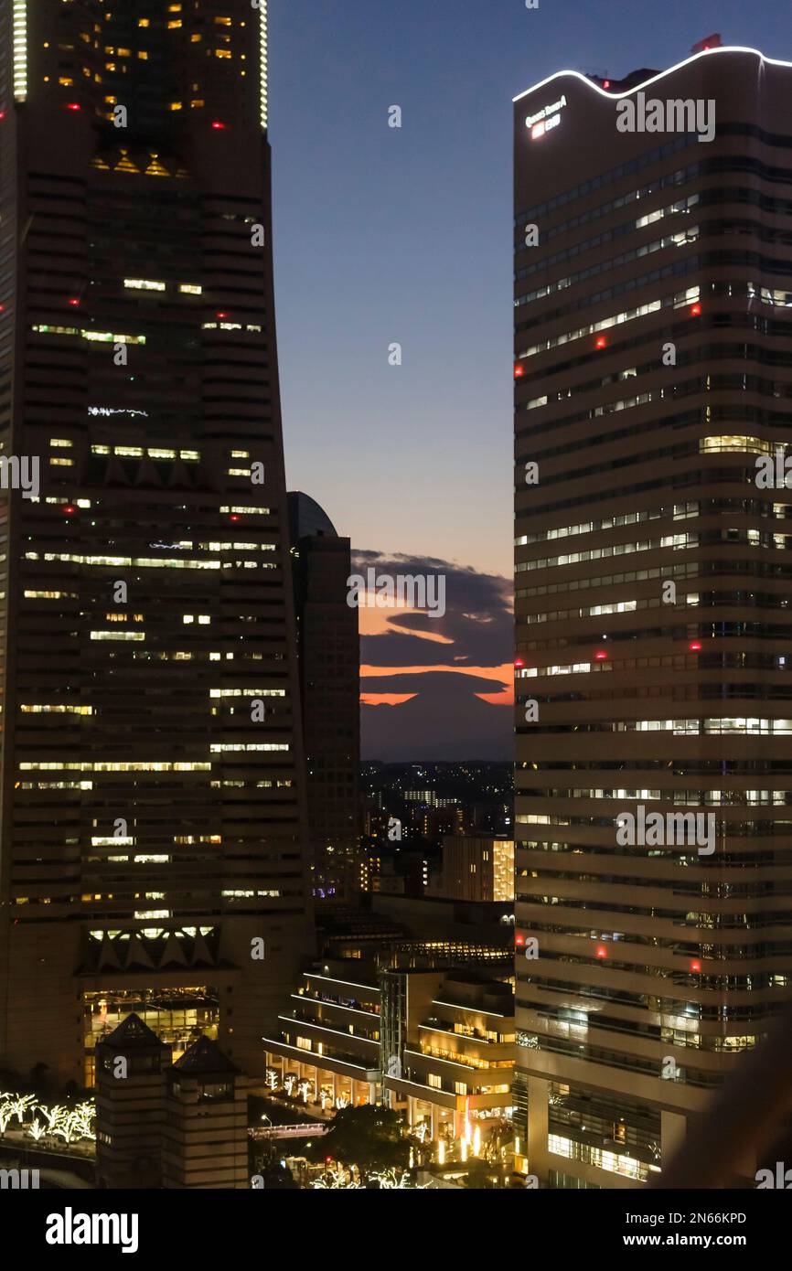 Silhouette of Mount Fuji between skyscrapers, from Ferris wheel, MInatomirai, Yokohama city, Kanagawa province, Japan, East Asia, Asia Stock Photo