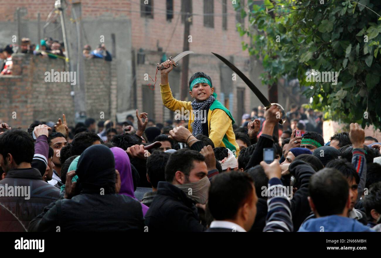 Kashmiri Shiite Muslims shout slogans after they were stopped by police ...