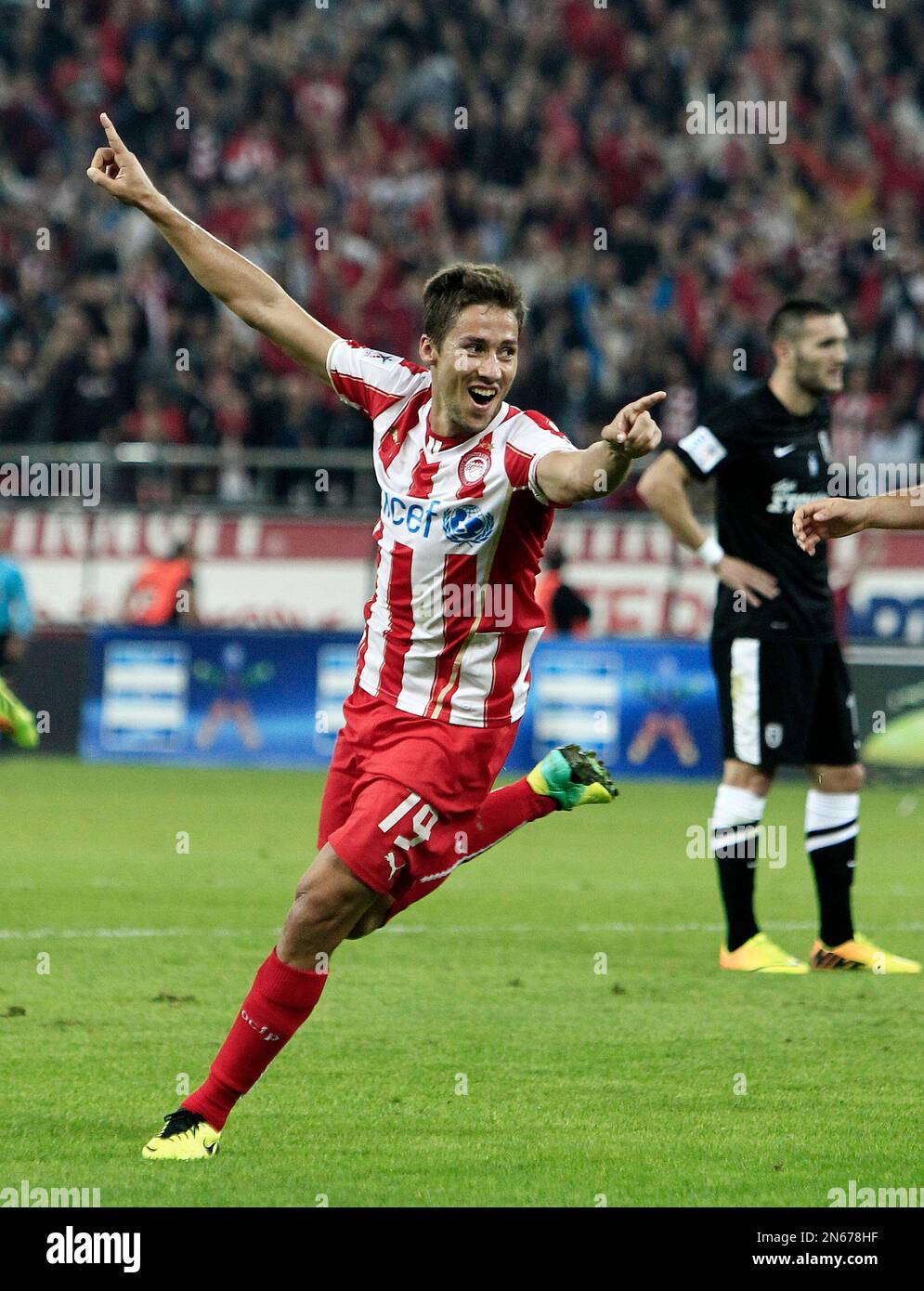Olympiakos' David Fuster from Spain celebrates after scoring the third goal  of his team against PAOK during their Greek League soccer match in the port  of Piraeus, near Athens, Sunday, Nov. 10,