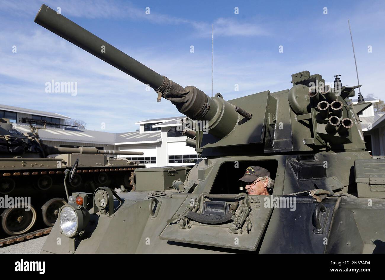 Jerry Rivard, a mechanic with the Collings Foundation, sits inside a ...