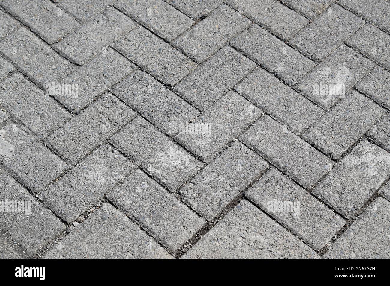 Paved tile texture at the bottom of the road. Concrete paving slab.With