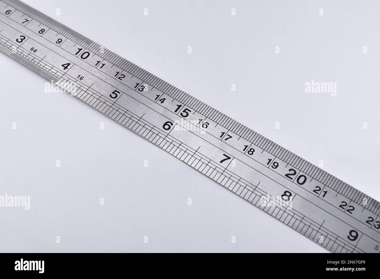 Iron Ruler isolated white background. Unit is Centimeters and inch. Stock Photo