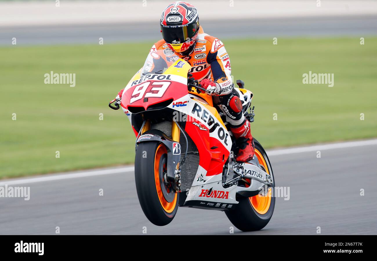MotoGP Honda rider Marc Marquez from Spain performs a wheelie 