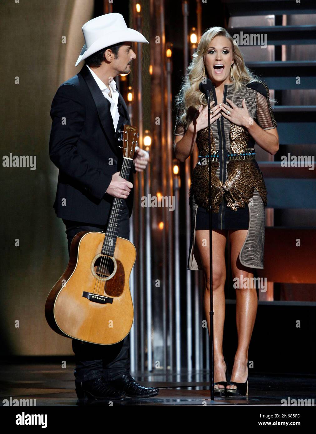 Cohosts Brad Paisley, left, and Carrie Underwood perform at the 47th