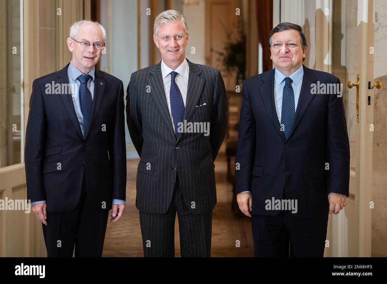 Belgium's King Philippe, center, poses for photographers with European Commission President Jose Manuel Barroso, right, and European Council President Herman Van Rompuy at the Royal Castle of Laeken in Brussels on Monday Nov. 4, 2013. (AP Photo/Geert Vanden Wijngaert) Stock Photo