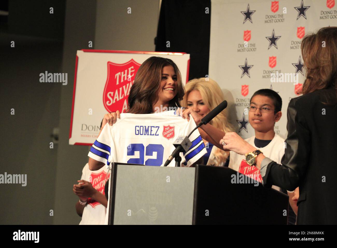 Entertainer Selena Gomez holds a Dallas Cowboys jersey before the