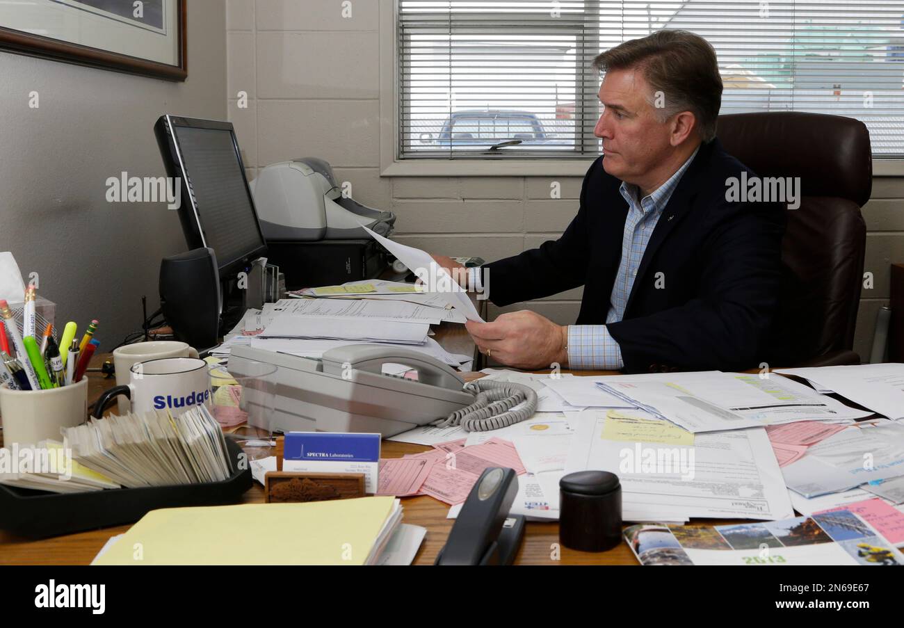 In this Friday, Oct. 25, 2013, photo, Fred Barkman Jr., owner of Spectra Laboratories, poses for