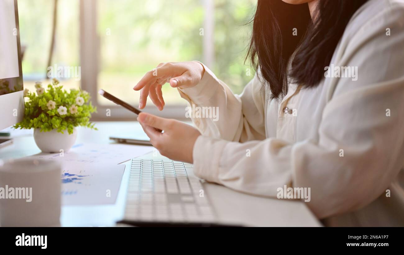 Female rear view mobile texting hi-res stock photography and images - Alamy