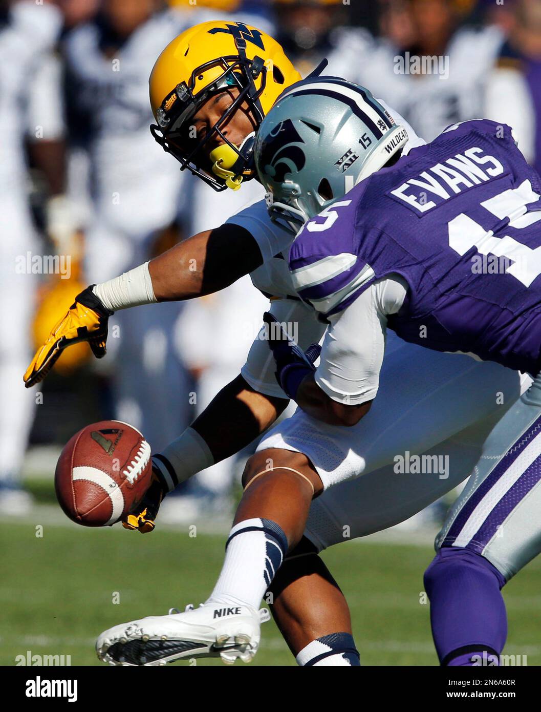Kansas State defensive back Randall Evans, right, knocks the ball away