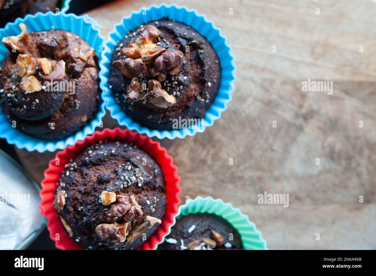 Freshly baked muffins , Cupcake molds . Homemade baking concept, top view. Stock Photo
