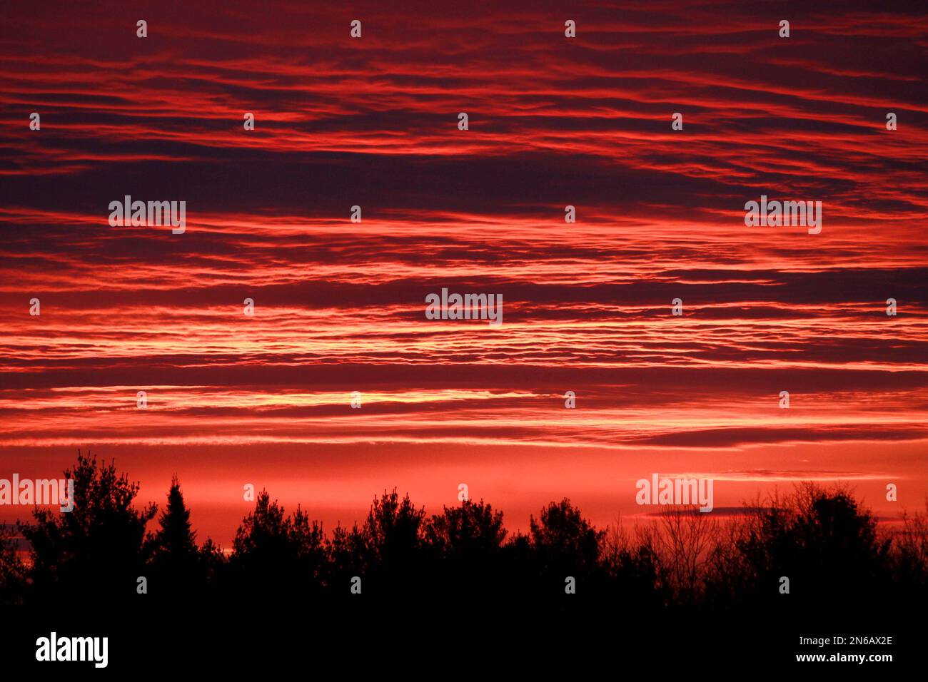 The sunrise colors the sky above Calais, Vt., on Tuesday, Oct. 22, 2013