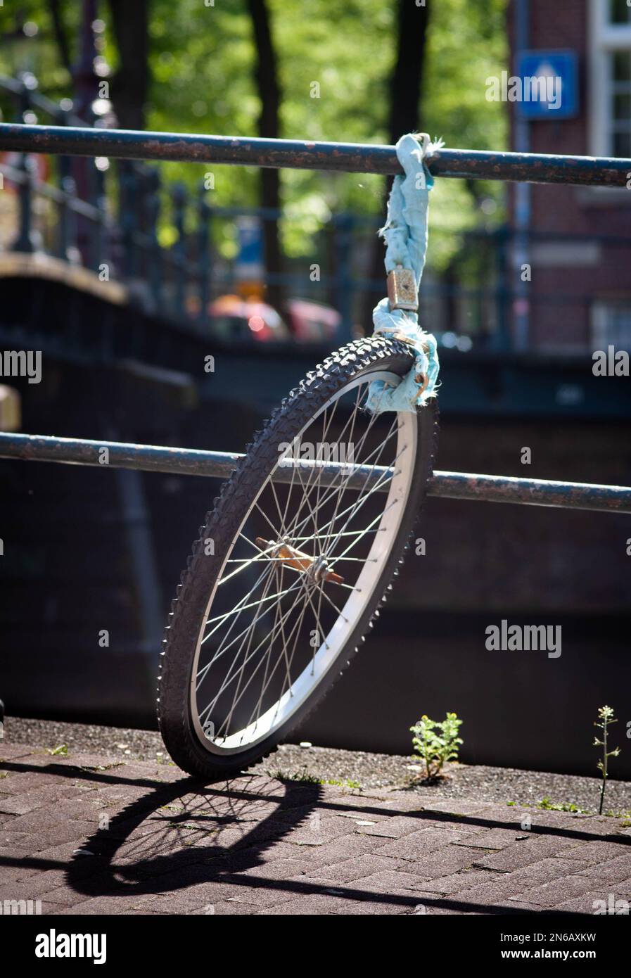 Stolen bike, remaining wheel locked, Amsterdam Stock Photo Alamy