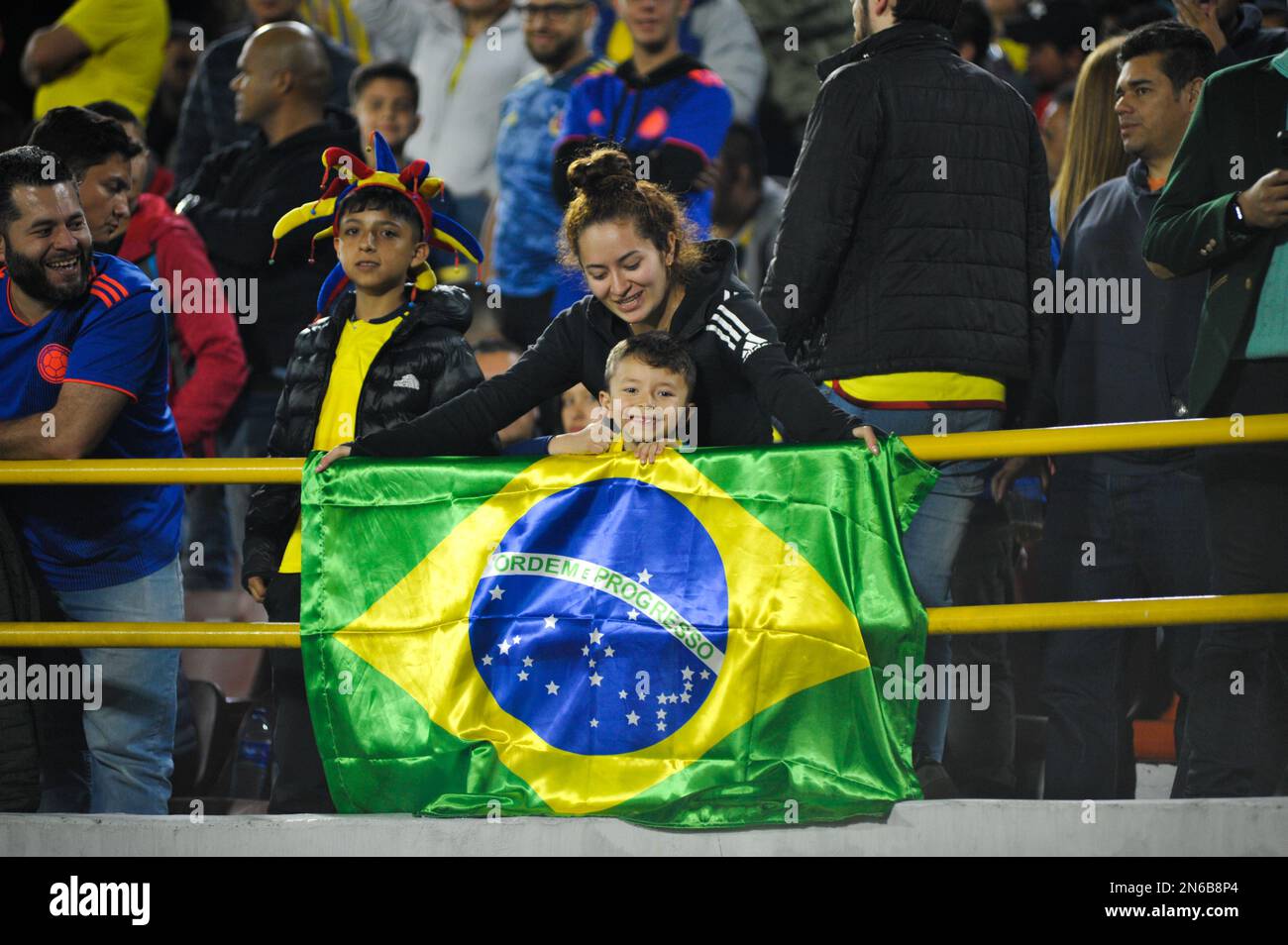 Bogota, Colombia on February 8, 2023. Fans of Brazil pose for a photo with a Brazil flag during the CONMEBOL South American U-20 Colombia tournament match between Colombia and Brazil, in Bogota, Colombia on February 8, 2023. Photo by: Chepa Beltran/Long Visual Press Stock Photo