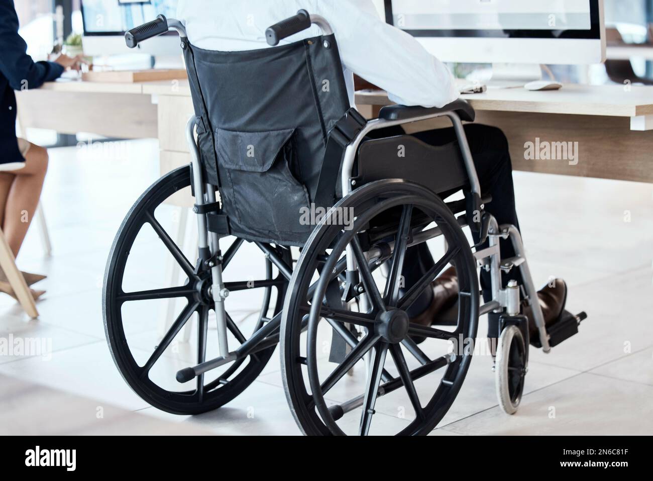 Wheelchair, office and business man disability in the workplace doing
