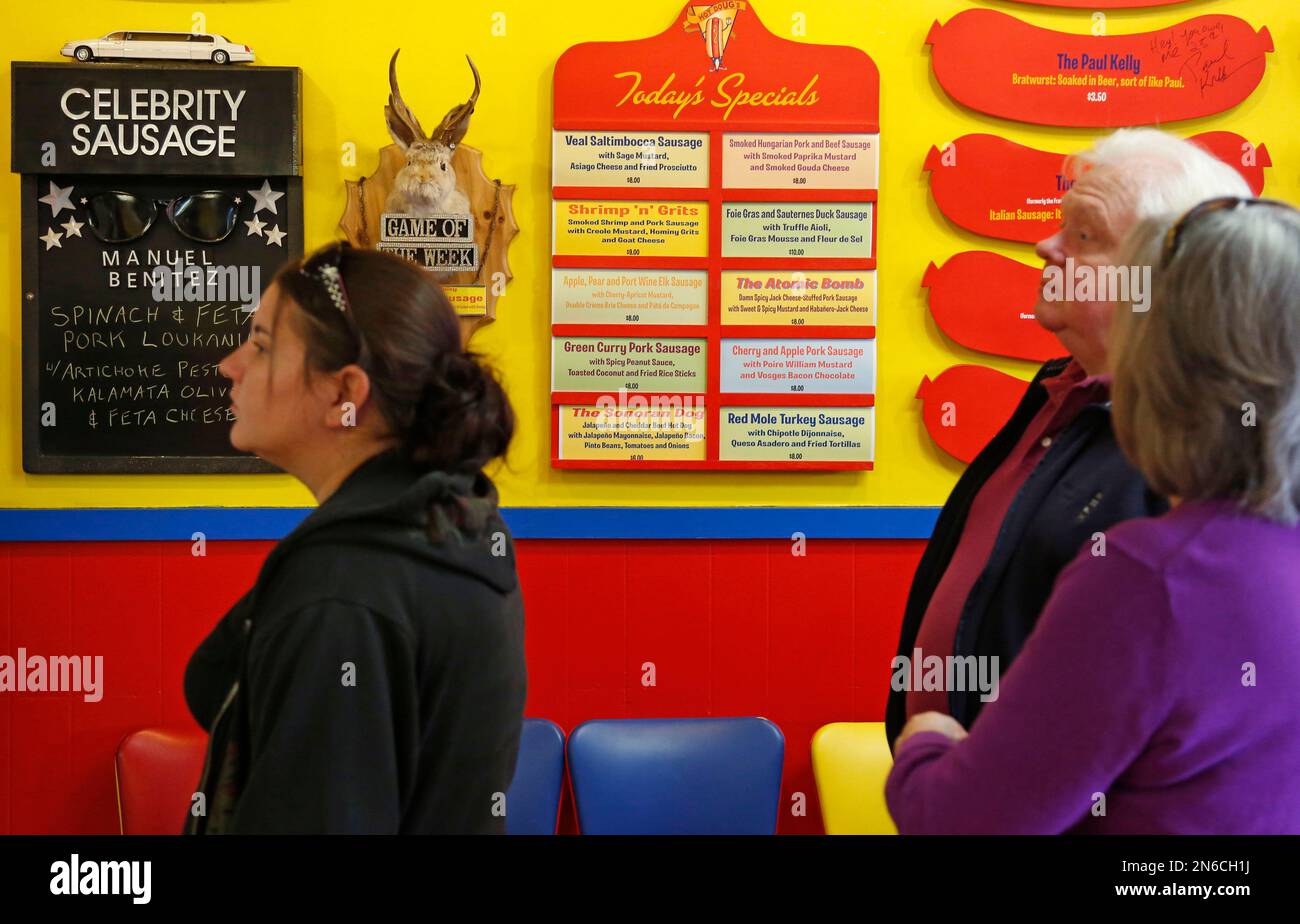 In this Oct. 9, 2013, photo, early customers line up next to unusual