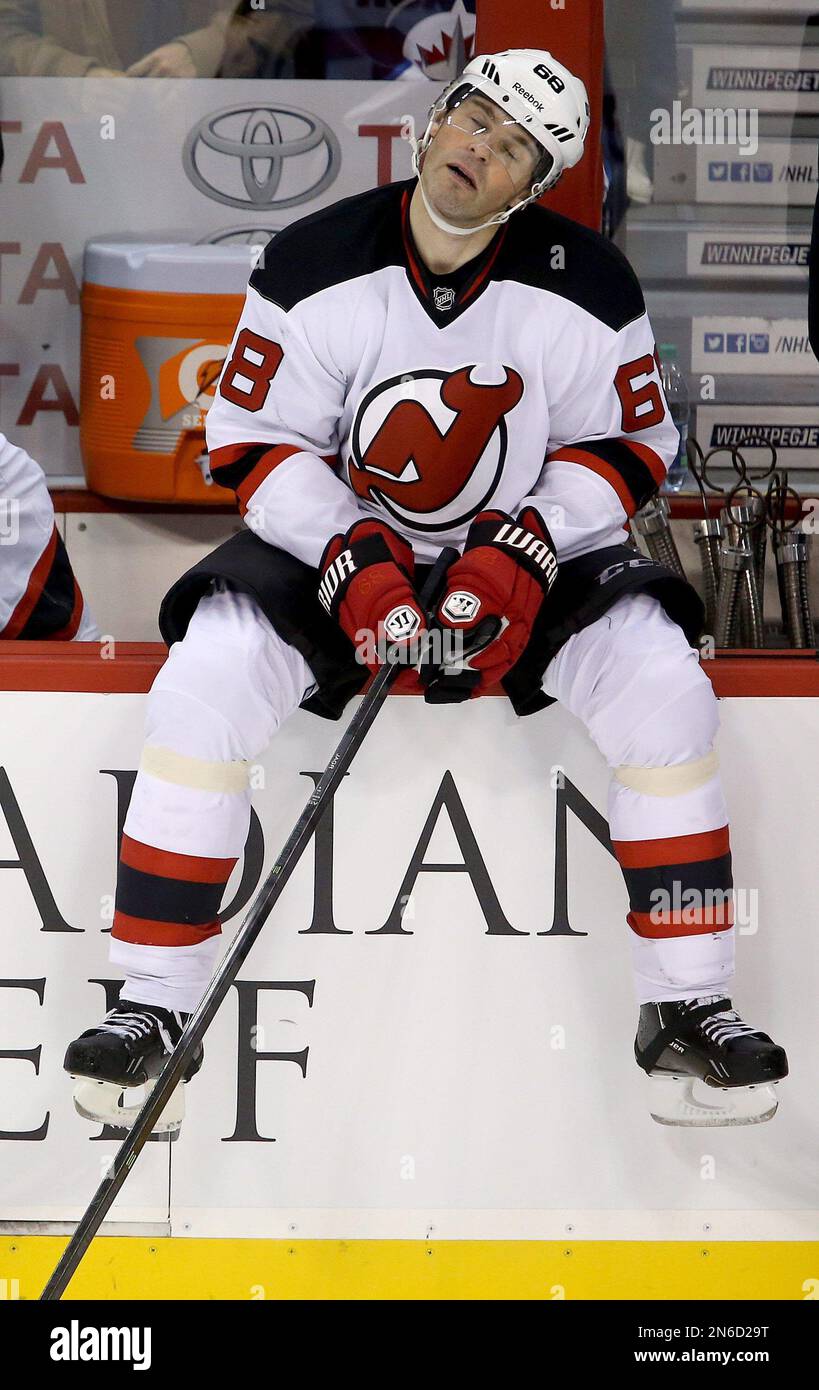 Jaromir Jagr of the New Jersey Devils walk to the bench prior to