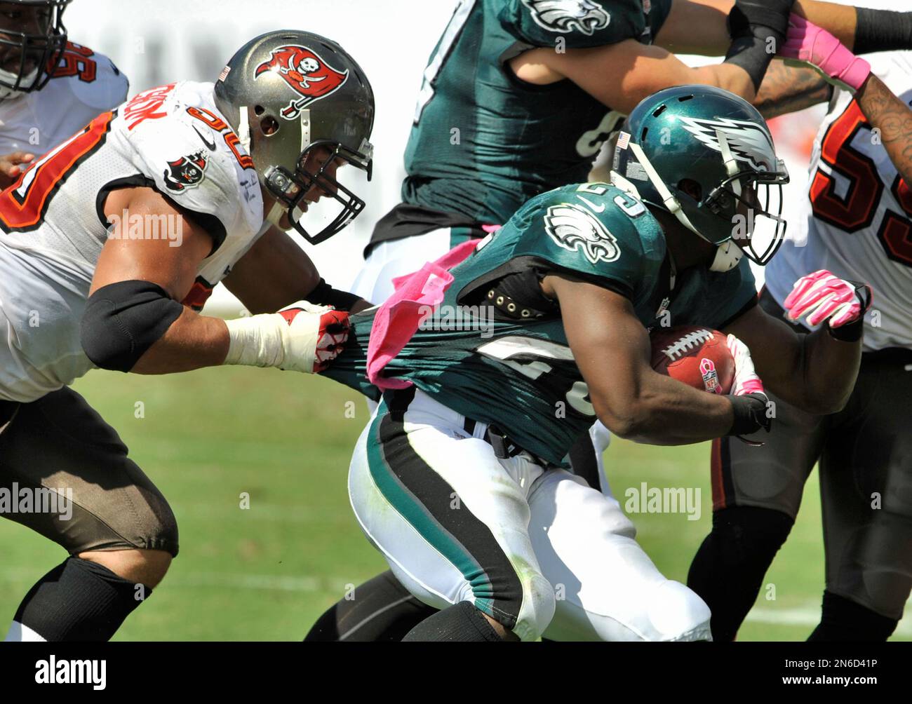 Tampa Bay Buccaneers' Daniel Te'o-Nesheim (50) grabs the jersey of  Philadelphia Eagles running back LeSEan McCoy (25) during their NFL  football game Sunday, Oct. 13, 2013 in Tampa, Fla. (AP Photo/Steve Nesius