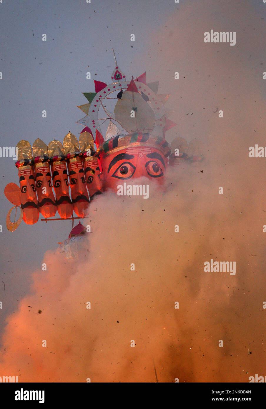 Smoke rises as an effigy of the ten-headed demon king Ravana burns ...