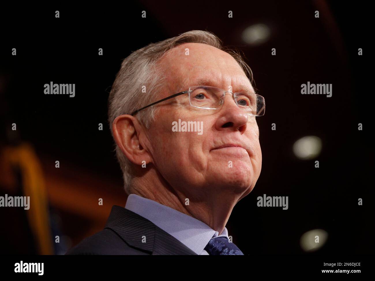 Senate Majority Leader Harry Reid of Nevada, listens to a reporter's question about their meeting with Senate Republicans regarding the government shutdown and debt ceiling on Capitol Hill in Washington, Saturday, Oct. 12, 2013. (AP Photo/Charles Dharapak) Stock Photo