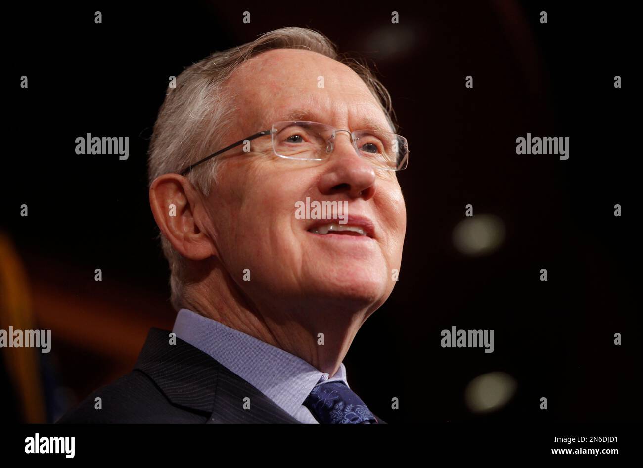 Senate Majority Leader Harry Reid of Nevada listens to a reporter's question about their meeting with Senate Republicans regarding the government shutdown and debt ceiling on Capitol Hill in Washington, Saturday, Oct. 12, 2013. (AP Photo/Charles Dharapak) Stock Photo