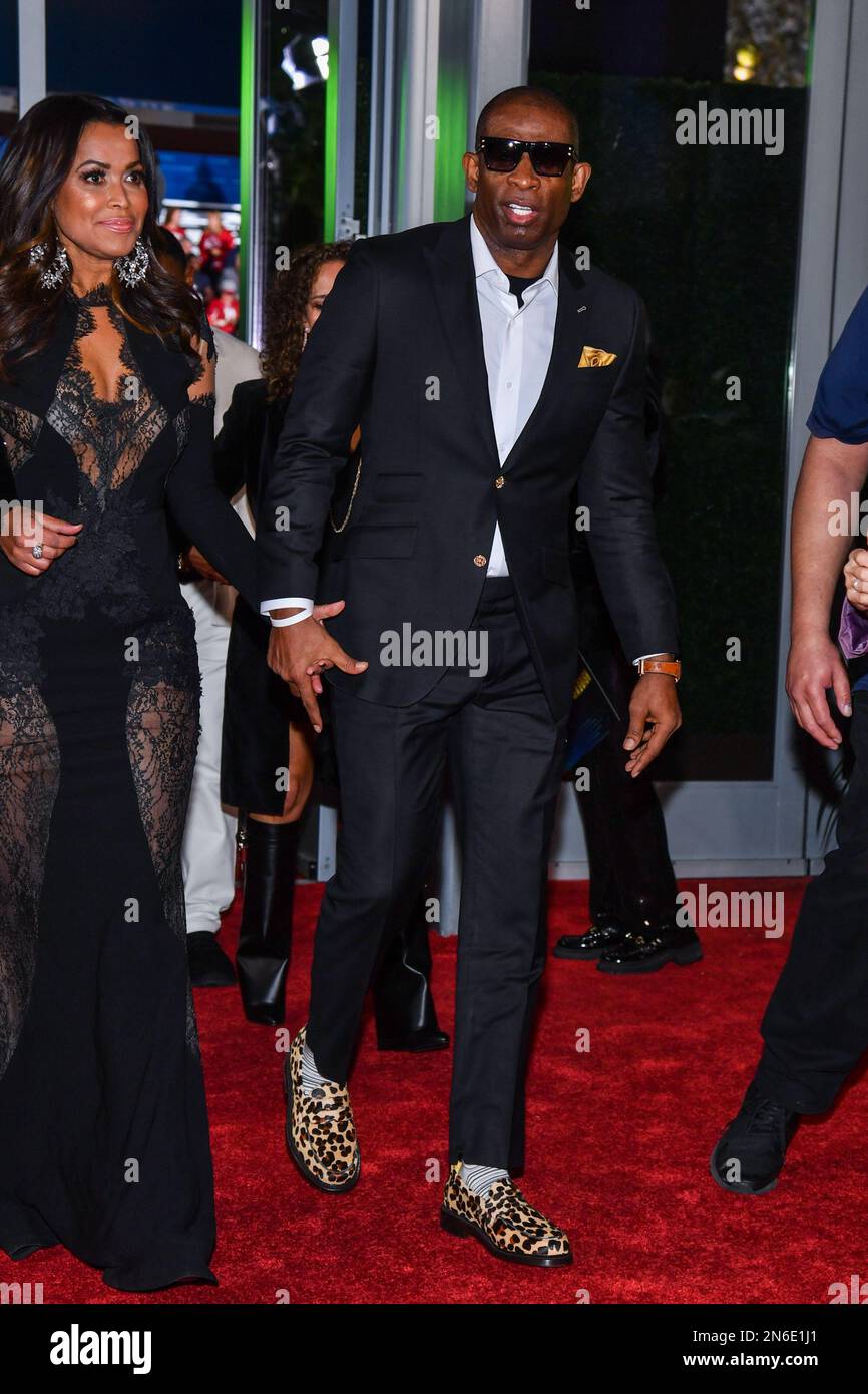 Tracey Edmonds and Deion Sanders walking on the red carpet at NFL