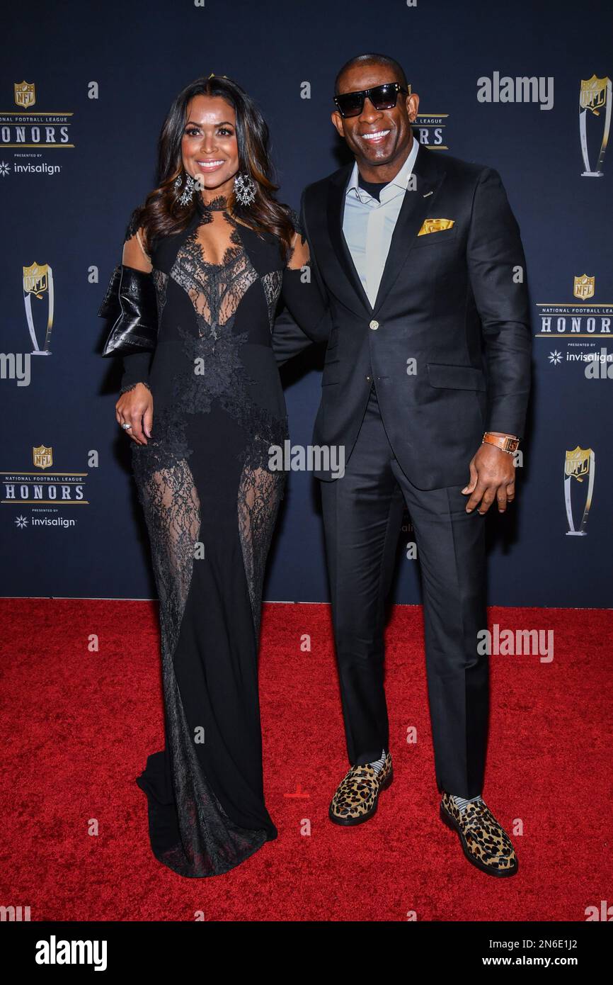 Tracey Edmonds and Deion Sanders walking on the red carpet at NFL