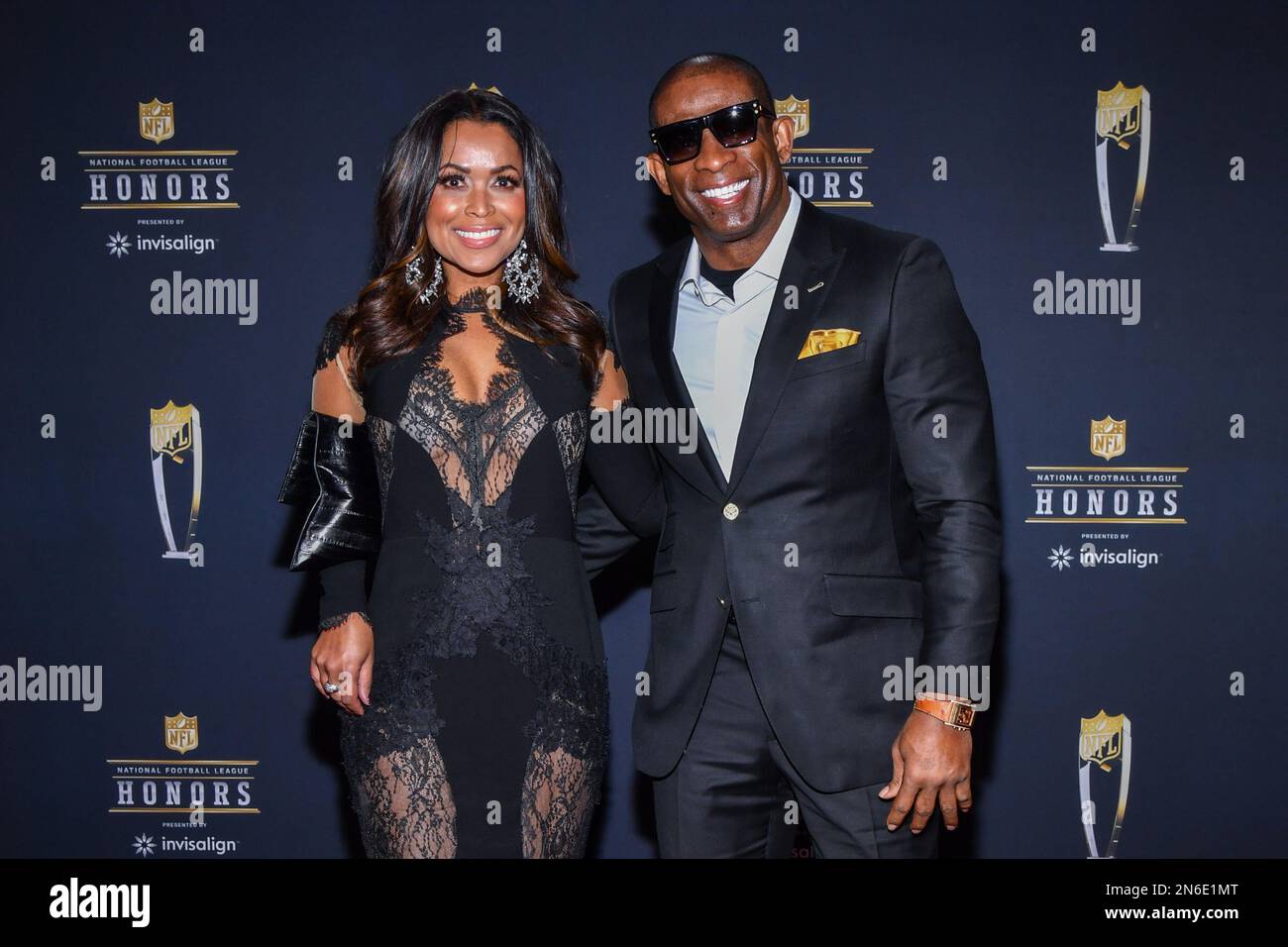 Tracey Edmonds and Deion Sanders walking on the red carpet at NFL