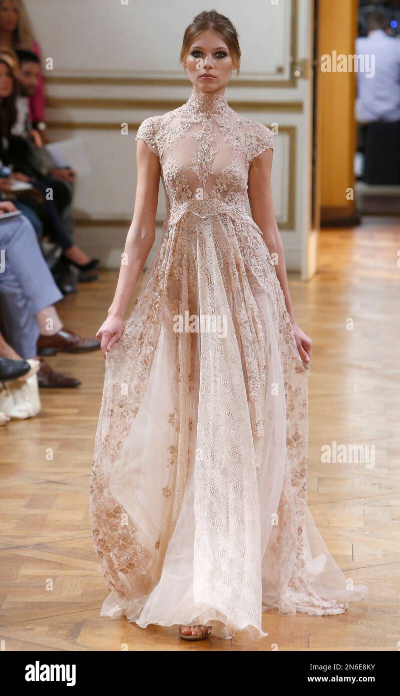 FILE - This July 4, 2013 file photo shows a model wearing a creation for  fashion designer Zuhair Murad's Haute Couture Fall-Winter 2013-2014  collection in Paris. Murad's celebrity clients include Jennifer Lopez,, image size:799x1390