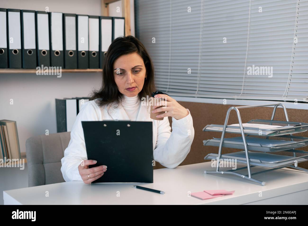Indian female doctor writing prescription hi-res stock photography and ...