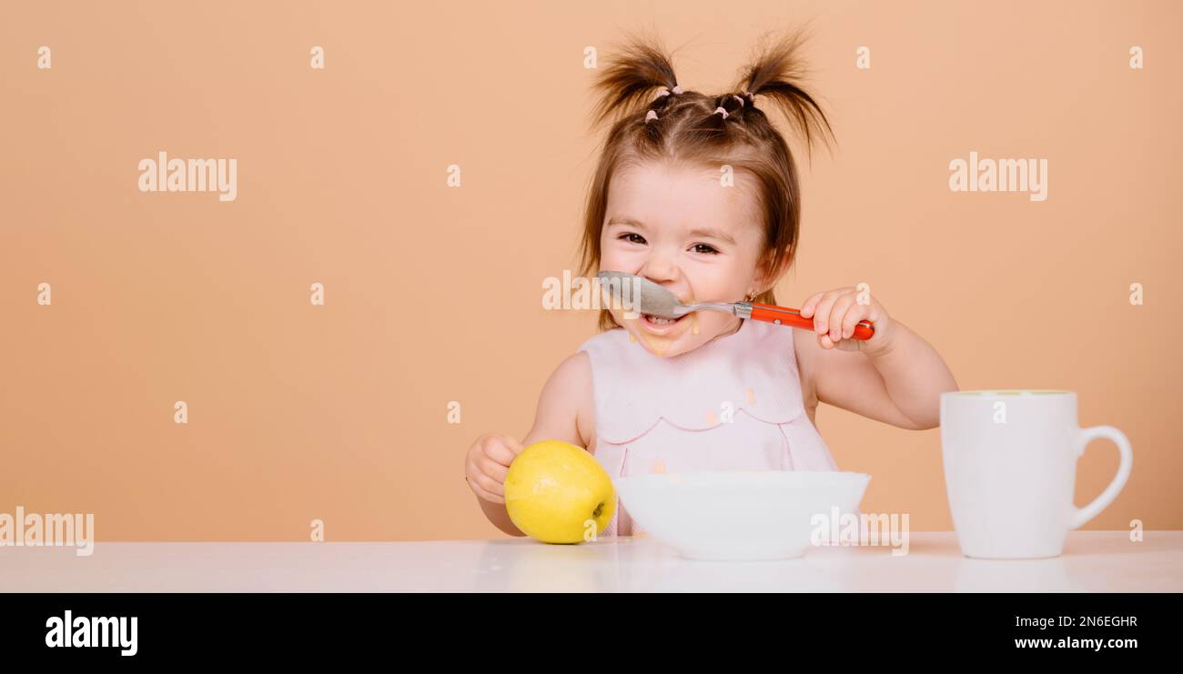 Baby food, babies eating. Little baby eating fruit puree Stock Photo Alamy