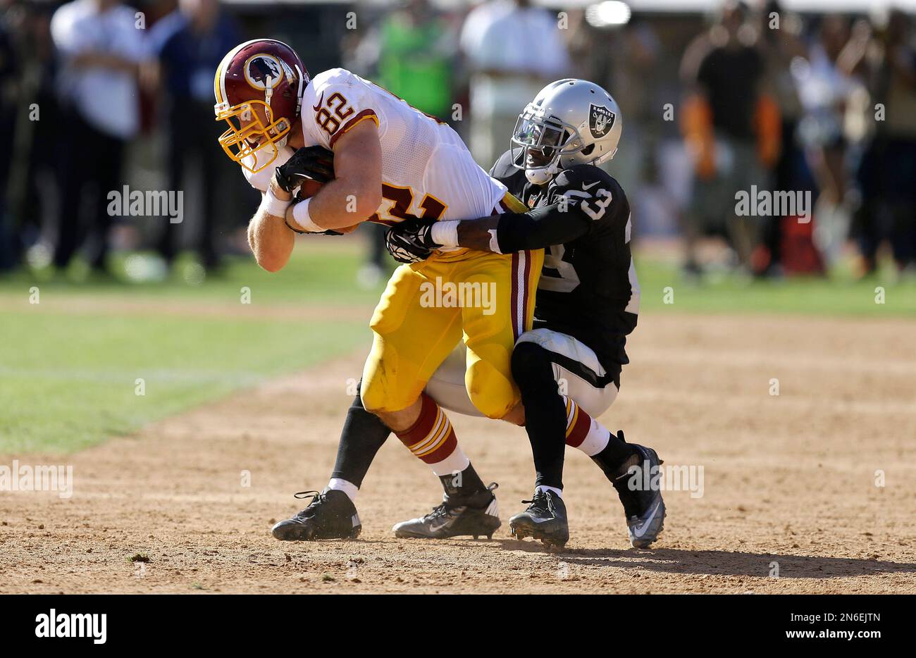 Washington Redskins' Logan Paulsen (82) is tackled by Philadelphia