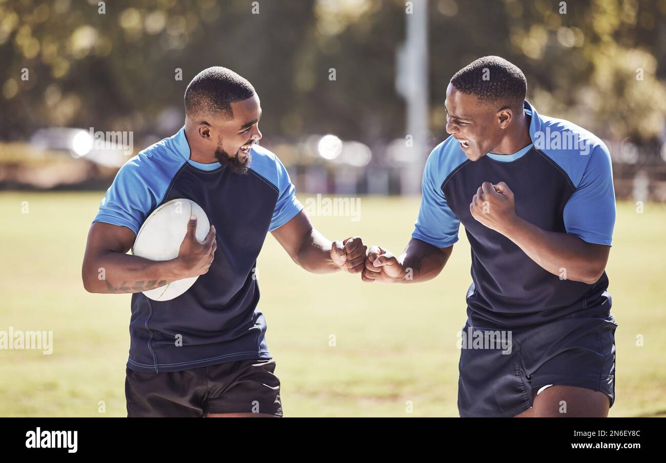 Playing Rugby Outside Two african american rugby teammates celebrating scoring a try or ...