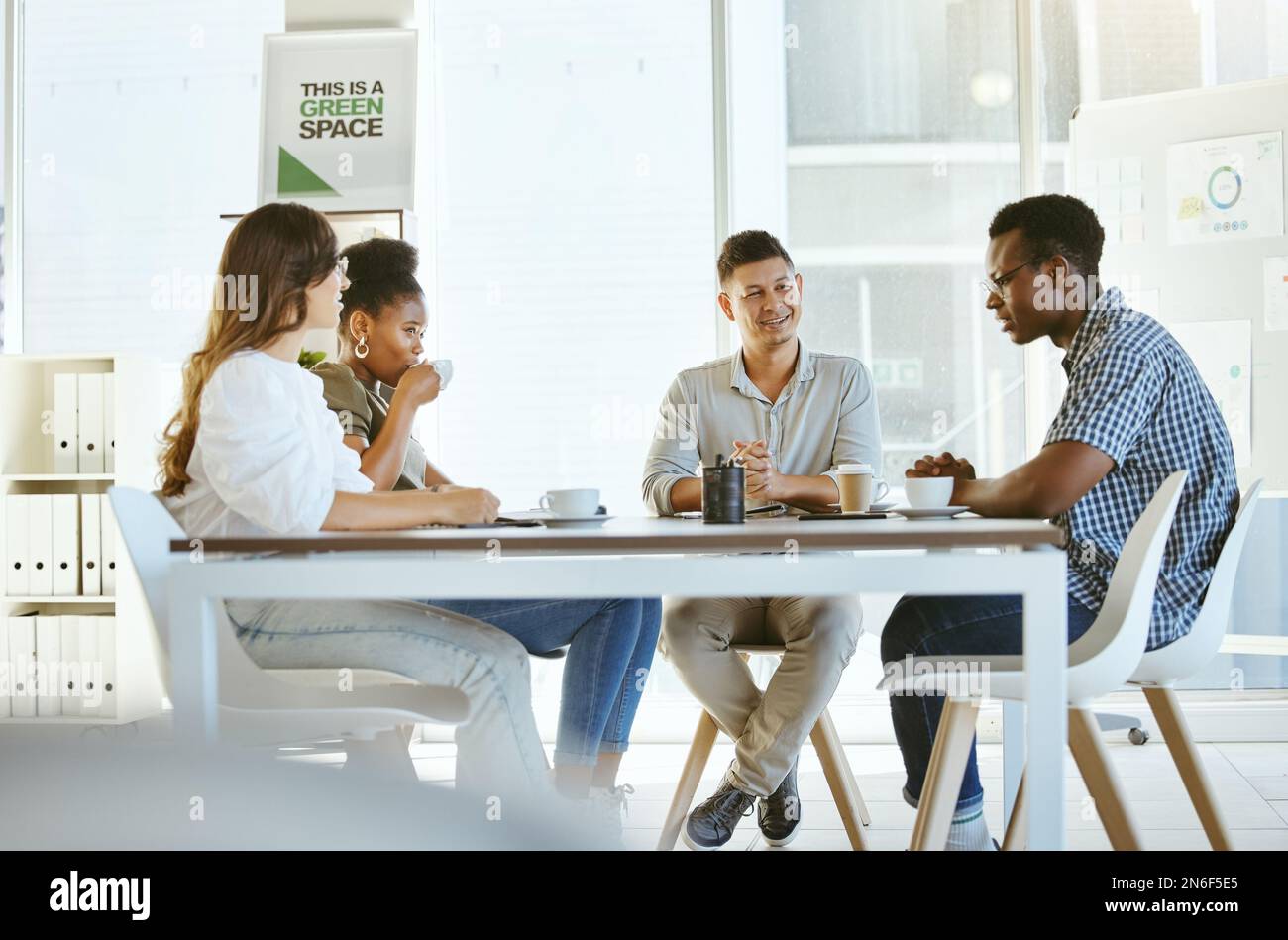 Group of diverse businesspeople having a meeting in an office at work ...