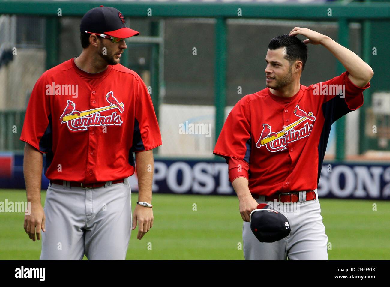 St. Louis Cardinals pitcher Joe Kelly, right, talks with pitcher Adam
