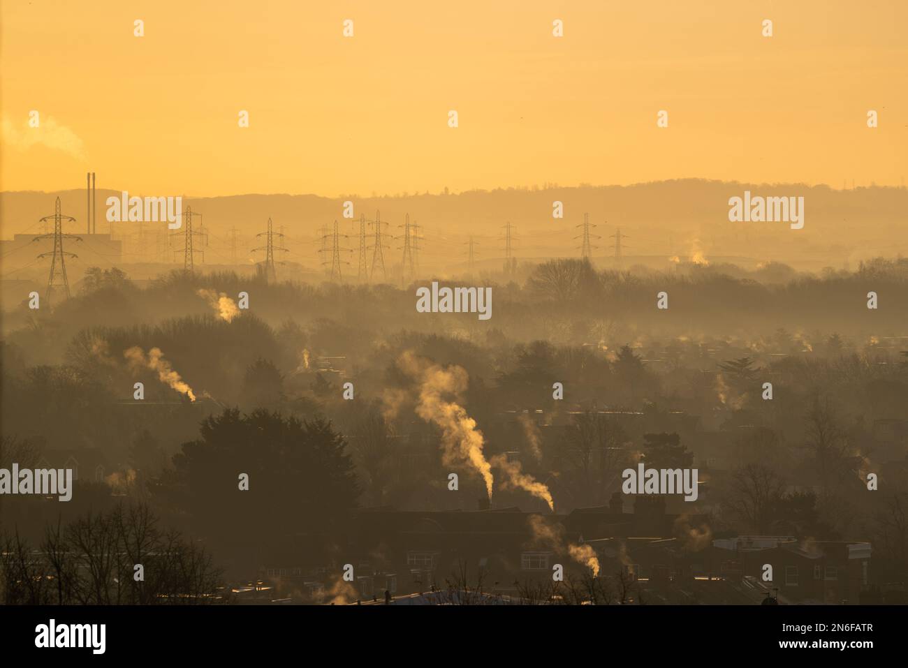 London, UK. 10 February 2023. Steam rises from residential rooftops on ...