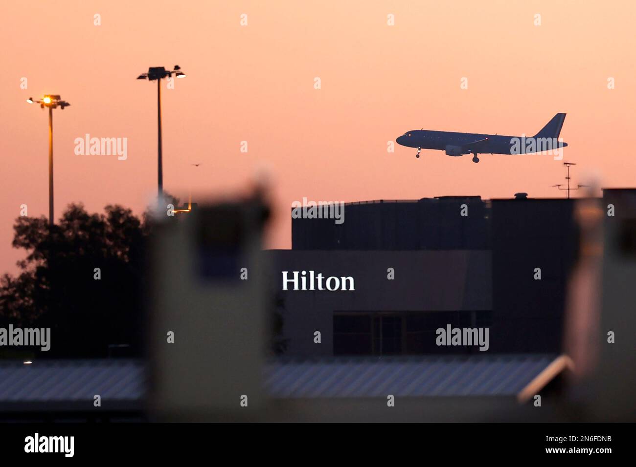 Rome, Italy, January 31, 2023. An aircraft of Italian state-owned flag carrier ITA overflies the Hilton Rome Airport Hotel as it lands at RomeÕs Fiumi Stock Photo