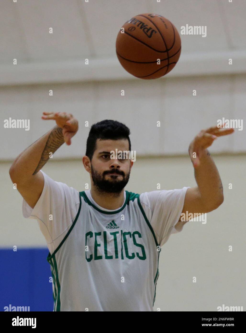 Boston Celtics center Vitor Faverani passes during an NBA basketball