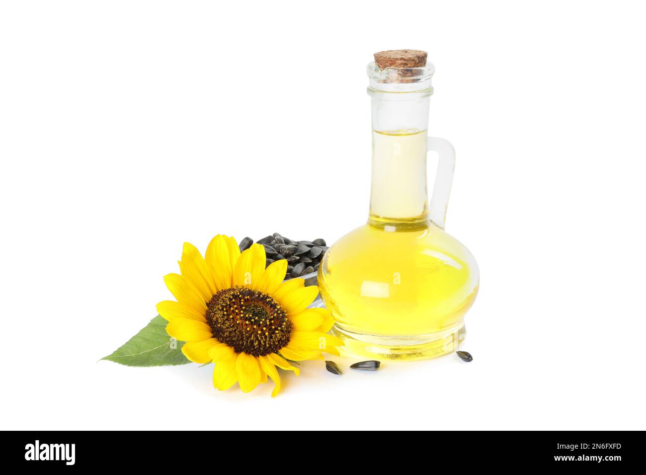 Sunflower, jug of oil and seeds on white background Stock Photo Alamy