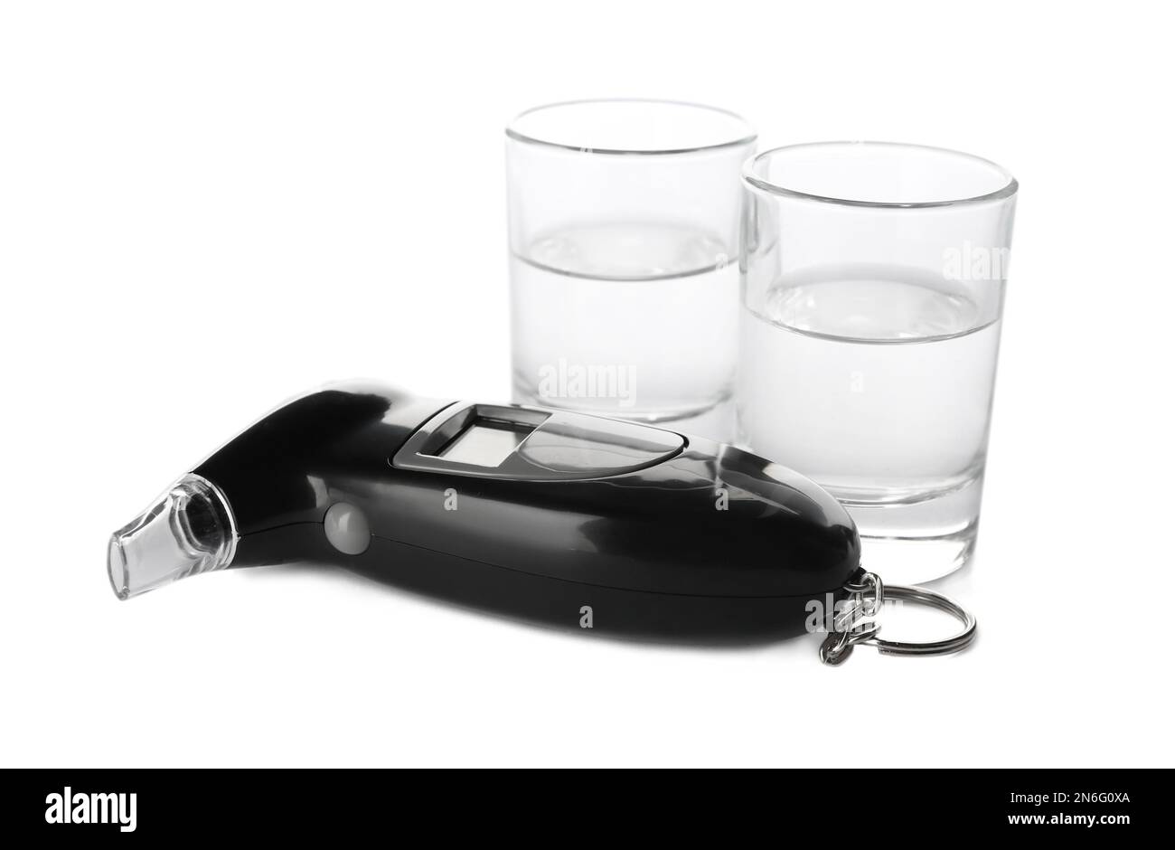 Modern breathalyzer and alcohol on white background Stock Photo