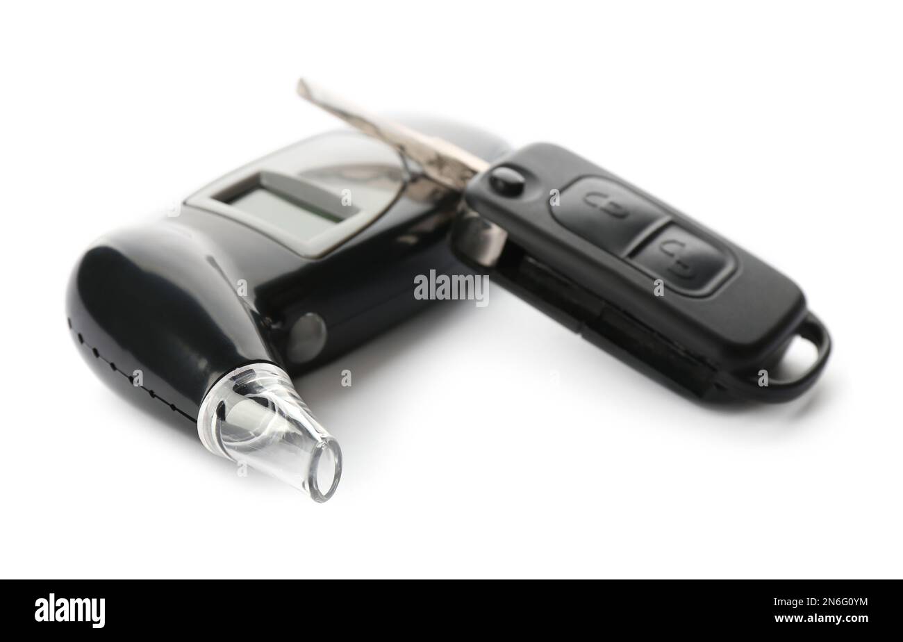 Modern breathalyzer and car key on white background Stock Photo Alamy