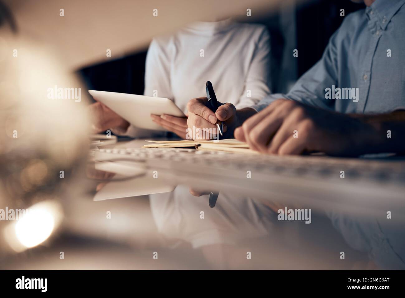 Tablet, night research or programmer team writing for cybersecurity, app coding or data analysis. Hands, developer or collaboration on tech for Stock Photo