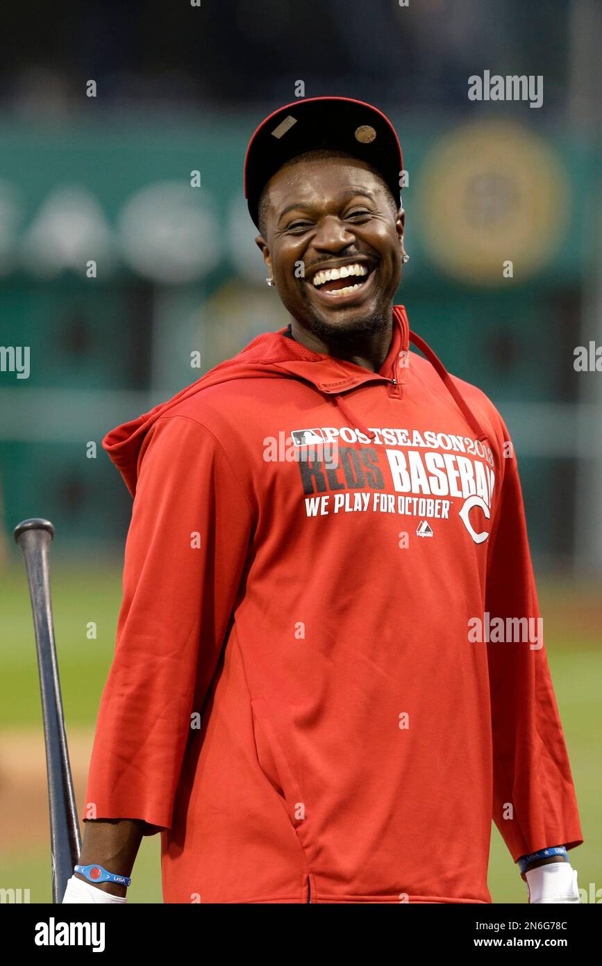 Cincinnati Reds Brandon Phillips waits his turn in the batting cage during  the baseball team's workout in Pittsburgh Monday, Sept. 30, 2013. The Reds  face the Pittsburgh Pirates in the National League
