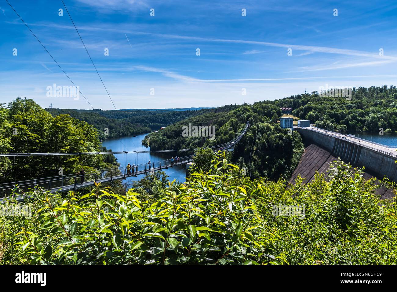 Titan RT rope suspension bridge over the Rappbodetalsperre (rappbode dam) in the Harz Mountains in Germany. Stock Photo