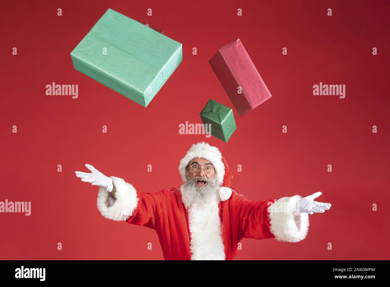 man santa costume throwing gifts air . Resolution and high quality