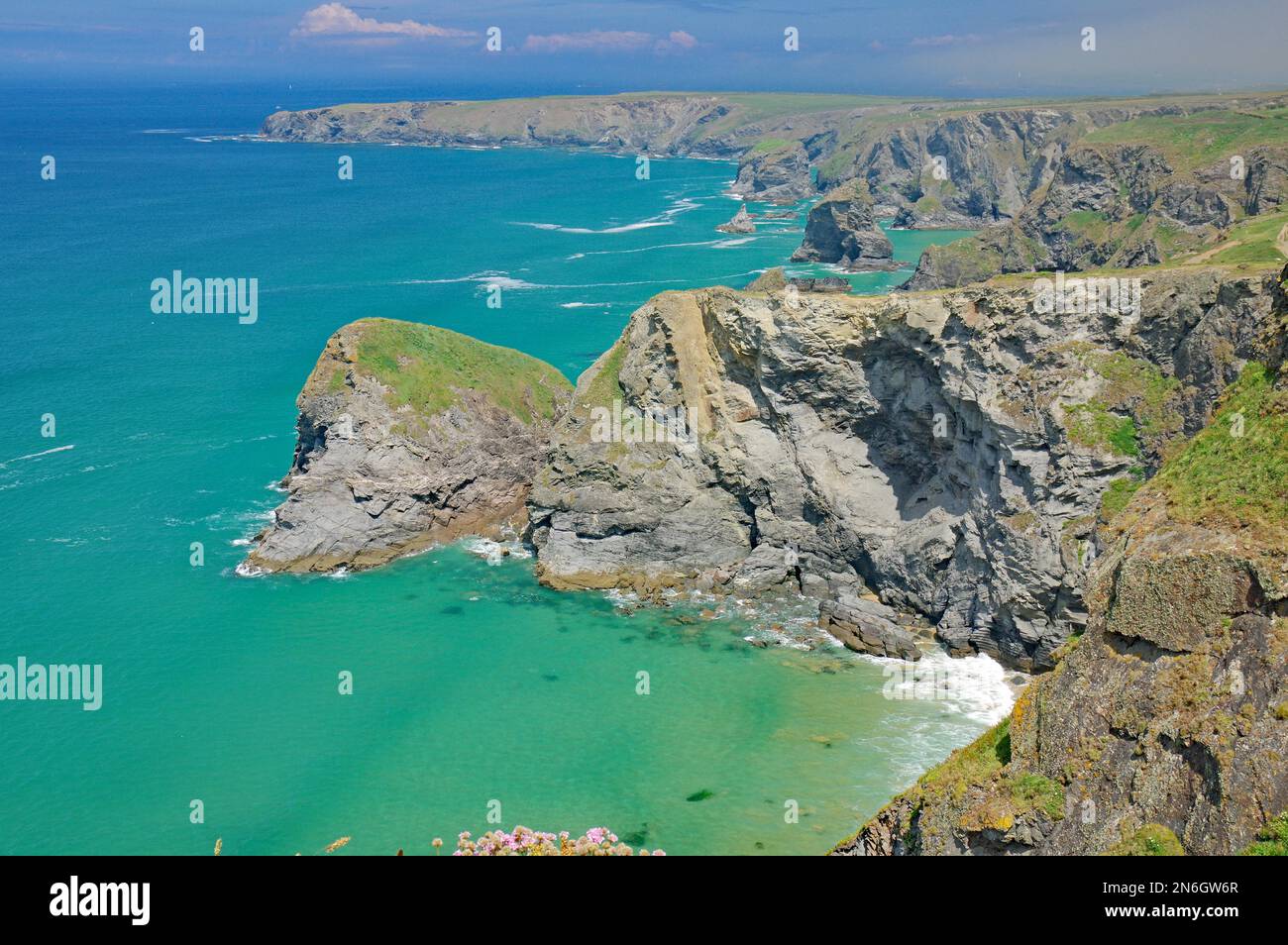 Rocks and cliffs in shallow water, Bethudran Steps, Newquay, Cornwall ...