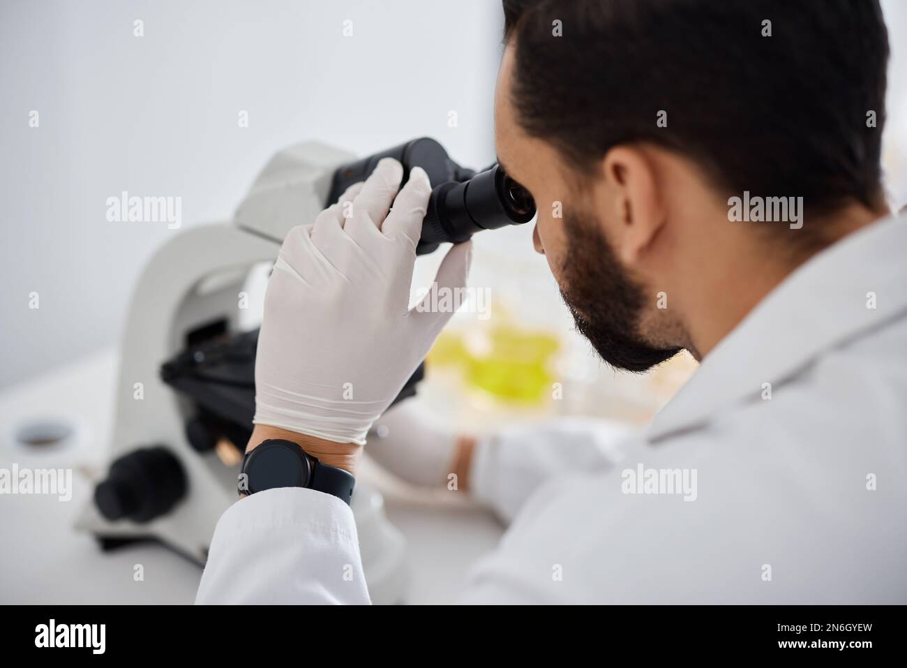 Microscope, medical and research with a man at work in a laboratory for ...