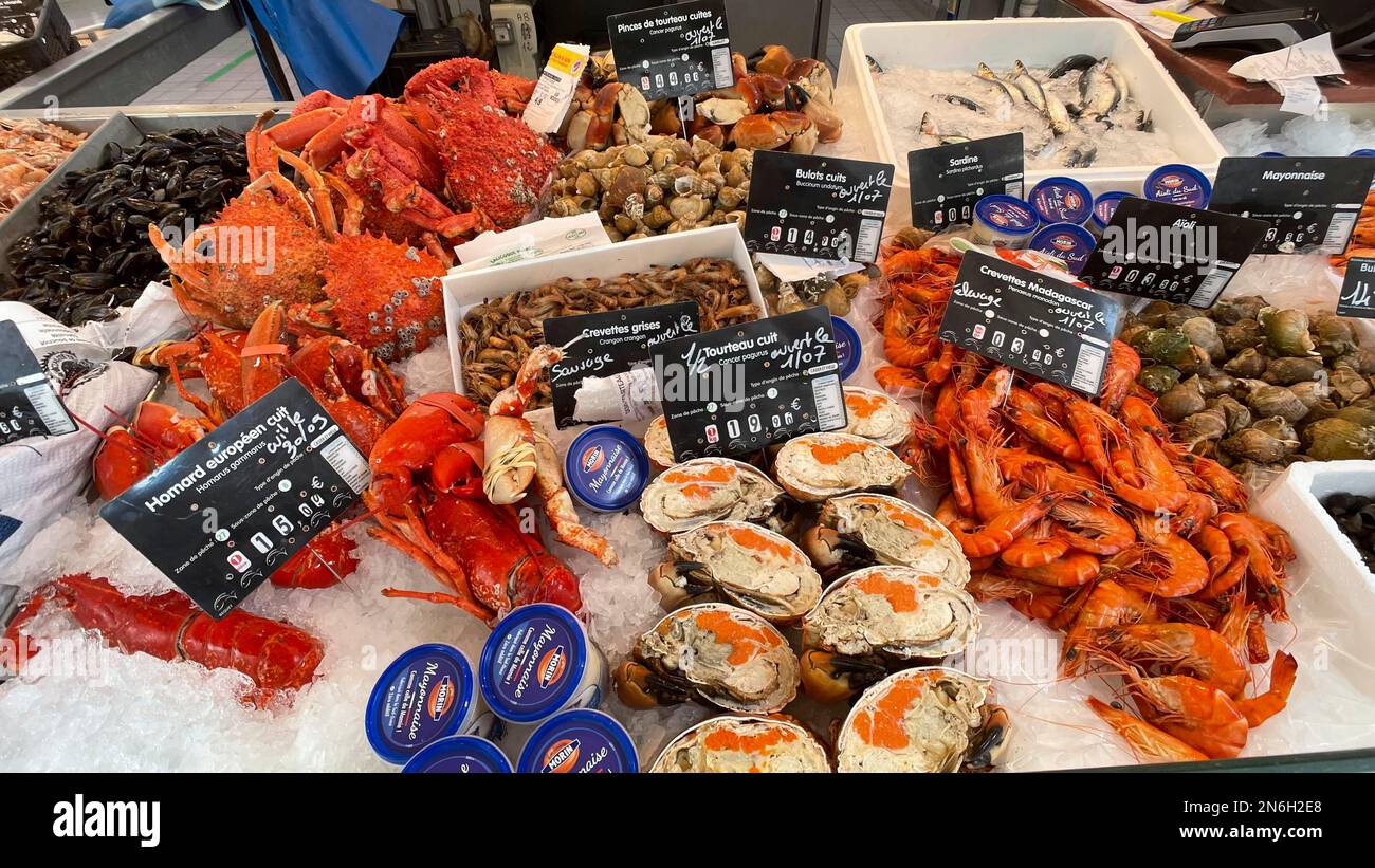 Display of a market stall with seafood such as crabs, lobsters, shrimps