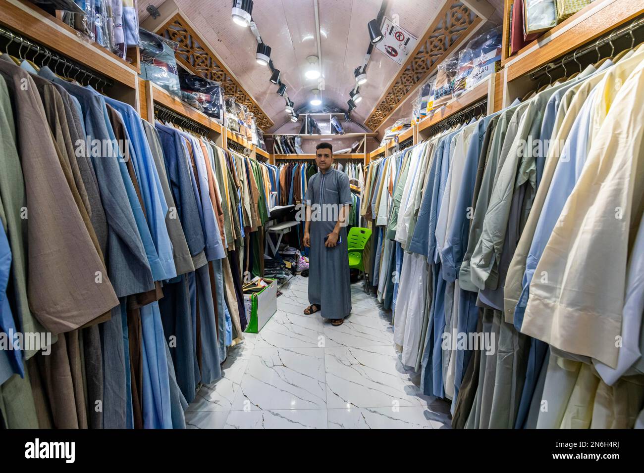 Man in his clothes shop, Ezekiel's Tomb, Al Kifl, Kerbala, Iraq Stock Photo