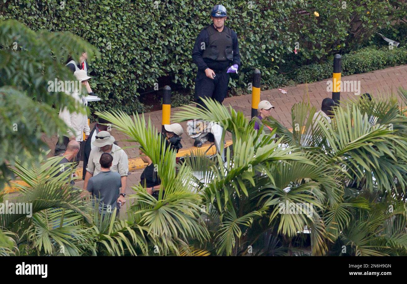 A member of a team of international and Kenyan forensics investigators