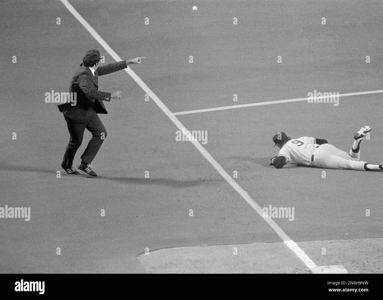 Umpire Bill Deegan signals fair ball as the ball gets by Yankee third  baseman Graig Nettles (9) in Sixth inning of the third American League  playoff game at Royals Stadium, Oct. 7